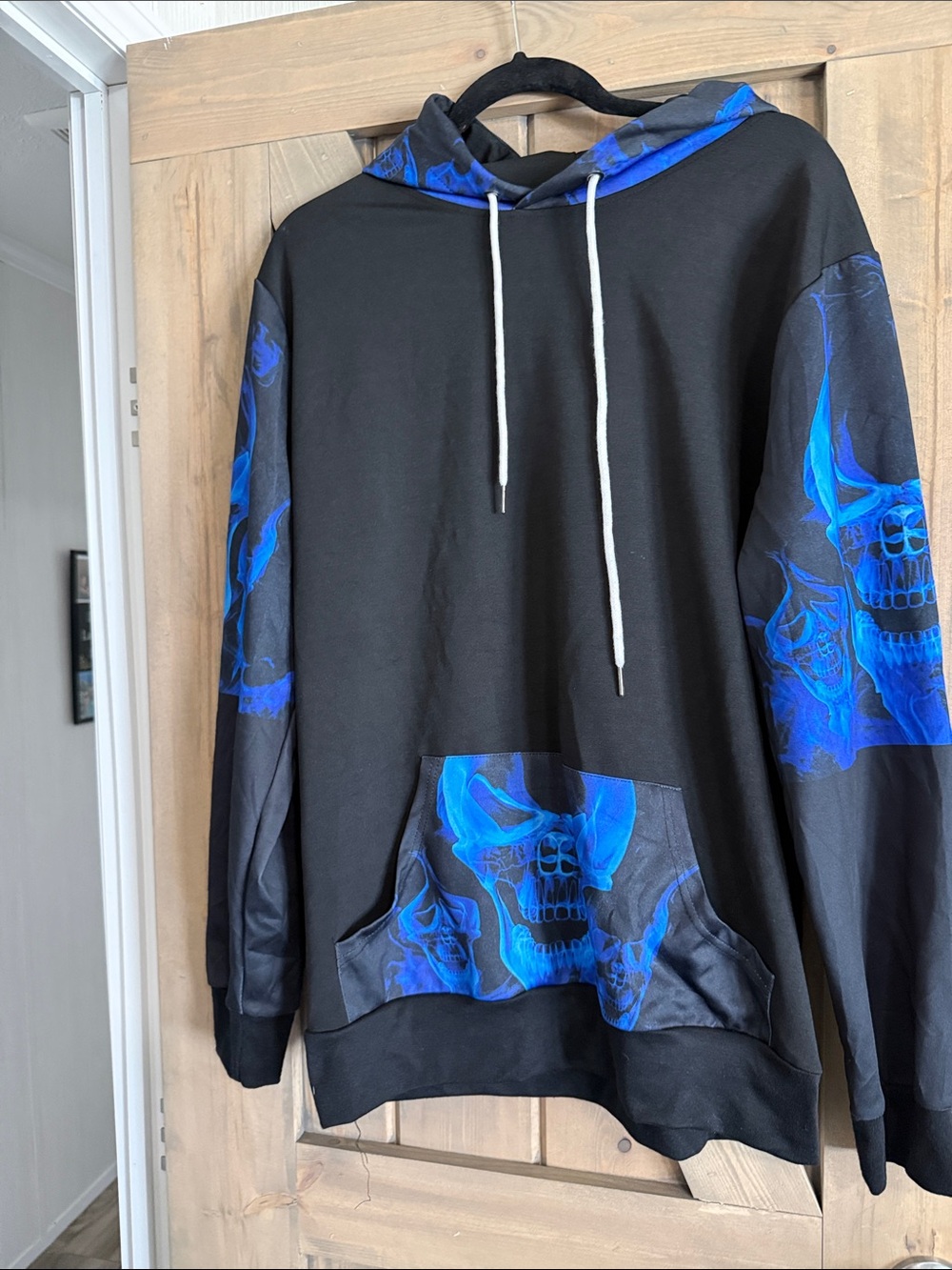Black Hoodie with Blue Skull Graphic Pullover